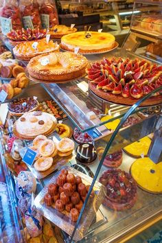 a display case filled with lots of different types of pastries