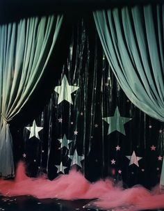 an image of stage curtains with stars on them