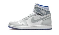 The Air Jordan 1 High Zoom “Racer Blue” adds upgraded cushioning and a sleek color scheme to Michael Jordan’s first signature shoe. The clean construction includes a perforated toe area done up in white leather that is contrasted by light grey patent leather overlays on the forefoot, eyelets, and heel. The collar, side Swooshes, and heel panel all feature a clear synthetic material. Blue accenting is found on the liner. A icy blue outsole with a red-to-blue gradient visible underneath completes Blue Air Jordan 1, Jordans Retro, Blue Basketball Shoes, Jordan Ones, Exclusive Sneakers, Air Jordan 1 Retro High Og, Nike Dunk High, Air Jordan 1 Retro High, Nike Shox