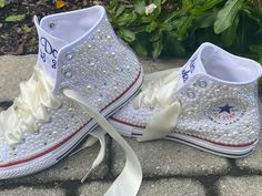 Embroidered Converse! Monochrome All WHITE Converse with white and ivory mixed pearls and rhinestones encrusted all over the shoe. ! I can do all white pearls or all ivory. (I will do the mixture if you do not specify in your order ) These shoes will sparkle and get noticed across the room! They are beautifully embroidered and hand done and each pair will be a bit different. This listing shows the I Do pattern but I can put your name or monogram on them as well as the date or Mrs. Smith. Your ch White Embellished Low-top Wedding Shoes, Embellished White Wedding Shoes For Bridal Shower, White Wedding Shoes With Pearl Embroidery, Wedding White Embellished Sneakers, Embroidered Wedding Shoes, All White Converse, Embroidered Converse, Wedding Converse, Mrs Smith