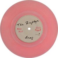 the red hot chili peppers vinyl record with autographed label on it, in pink