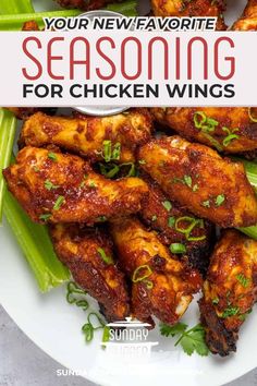 a white plate topped with chicken wings and green beans