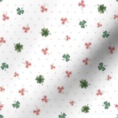 a white background with green and red shamrocks