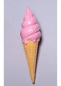 an ice cream cone with pink icing on it