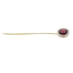 A fine antique Edwardian stickpin  In 14k gold with a platinum frame to the head.  Bezel-set with a richly colored oval-cut garnet gemstone.  Simply a wonderful period piece!  Date: Early 20th Century  Overall Condition: It is in overall good, as-pictured, used estate condition.   Condition Details: The pin head and frame are in good condition. There is some wear to the pin stem with noticeable scratches. Otherwise, there is some light edge wear, some fine and light surface scratches, and other Heirloom Oval Brooch For Formal Occasions, Oval Brooch In Fine Jewelry Style For Formal Occasions, Formal Round Gemstone Brooches, Formal Rose Cut Diamond Brooches, Classic Oval Cabochon Brooches, Oval Hallmarked Brooch For Formal Occasions, Formal Oval Hallmarked Brooch, Formal Oval Hallmarked Brooches, Pin Head