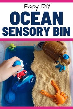 an ocean activity bin with sand, toys and sea animals in it for kids to play