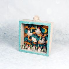 a small box filled with lots of different types of birds on top of each other