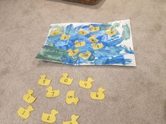 a child's drawing with yellow rubber ducks on the floor