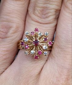 Vintage Designer 14k Yellow Gold Starburst Genuine Pink Sapphire & Diamond Ring Super Sparkly & Feminine design Fun starburst form Triple band joins halfway down the sides to one Very comfortable to wear Ring size 6.5 Total weight of pink sapphires is approximately .28 carat Total weight of diamonds is approximately 1/4 carat All stones are natural, genuine Designer stamp is CE Thanks for shopping with CyberJazzy!! Pink Sapphire Diamond Ring, Diamond Rings With Price, Gold Starburst, Coin Pendant Necklace, Precious Jewels, Sapphire Diamond Ring, Coin Pendant, Vintage Designer, Dream Jewelry