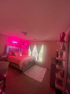 a bed room with a neatly made bed next to a window and a pink light