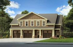 a two story house with three car garages on the front and one above the garage