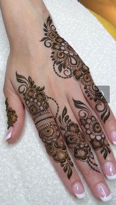 a henna tattoo is shown on someone's hand