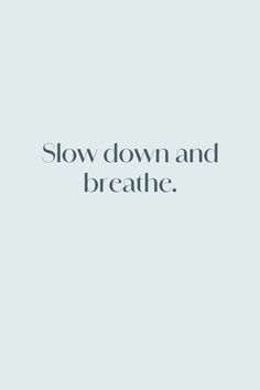 the words slow down and breathe are in black on a light blue background with white lettering