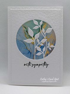 a white card with a blue and yellow design on it that says, wifty sympathy