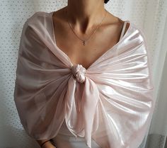 "Bridal shawl wrap, Pastel powder pink chiffon dress cover-up, Summer evening shoulder wrap, Mother of the bride stole, Bridesmaids formal scarf This minimalist shawl is made of powder pink (blush) chiffon fabric with shiny metallic effect. Dim: It fits into 20.5\"x 59.8\" (50x152cm) With its elegant and refined look, it can be worn during the day at the office or at a cocktail reception, etc. It comes in 3 color choices: candy pink, gray, cream For more similar wedding & evening cover-ups, Elegant Wedding Wrap, Elegant Sheer Shawl For Wedding, Elegant Sheer Wedding Shawl, Elegant Pink Shawl For Party, Elegant Pink Party Shawl, Shawl Wedding Dress, Wedding Dress Cover Up, Bridesmaid Scarves, Wedding Dress Cover