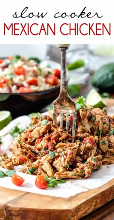 mexican chicken on a cutting board with a fork in it and the words slow cooker mexican chicken