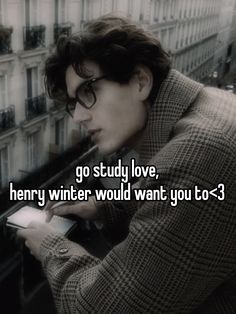 a man with glasses looking at his cell phone in front of a building and the words go study love, henry winter would want you to