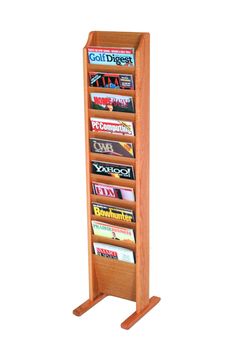 a wooden magazine rack with four magazines on the front and two sides, in an oak finish