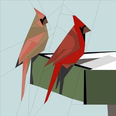 two red birds sitting on top of each other