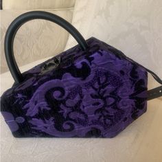 Widow Coffin Satchel Shoulder Bag Purse Brand New With Tag Limited Edition Soft Brocade Exterior Structured Coffin Shaped Bag, Keeps Its Shape, Isn’t Pliable Purple And Black Snap Lock Latch Closure Removeable Shoulder Strap Satchel Carrying Handle Lined Black Interior Vegan Leather Strap & Trim 9” X 7” All My Items Are Guaranteed Authentic Smoke Free Home Purple Square Shoulder Bag For Evening, Purple Square Evening Bag, Purple Evening Bags With Removable Pouch, Evening Purple Shoulder Bag With Top Carry Handle, Purple Shoulder Bag With Detachable Handle For Evening, Purple Evening Shoulder Bag With Detachable Handle, Evening Purple Shoulder Bag With Detachable Handle, Purple Top Handle Bag For Formal Occasions, Purple Party Shoulder Bag With Detachable Handle