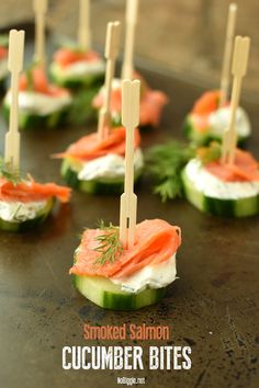 cucumber bites with smoked salmon and dill on them are ready to be eaten