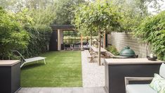 an outdoor patio with grass and seating area