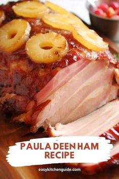 sliced ham with pineapples on top and text overlay that reads, paula denham recipe