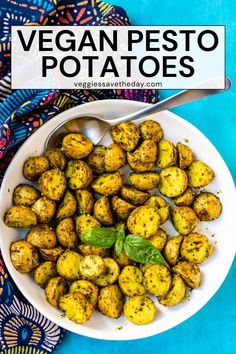 a white bowl filled with vegan pesto potatoes on top of a blue table