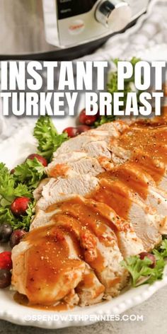 instant pot turkey breast on a plate with lettuce and tomatoes