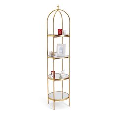 a gold metal shelf with three shelves