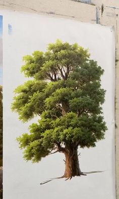 a painting of a tree is hanging on the wall