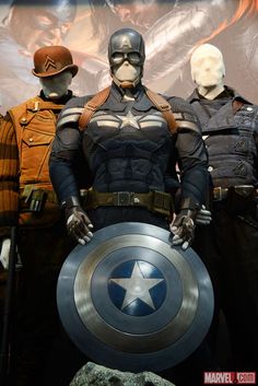 captain america the winter soldier costume is shown in front of two men dressed as soldiers