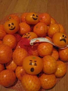 an image of oranges with faces drawn on them and the caption says cute idea always looking for party ideas that don't involve candy draw jack - lantern faces