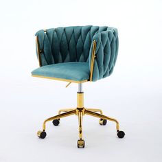 an office chair with wheels and a blue velvet upholstered seat, viewed from the front