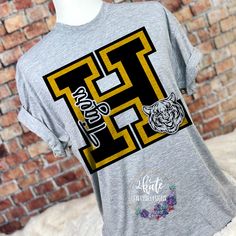 High School Football Shirts Spirit Wear, Tiger Shirts, School Mascot Shirt Ideas, High School Spirit Shirts, Elementary School Tshirt Designs, Spirit Wear Ideas, High School Sports Shirts, Elementary School Spirit Shirts, High School Sport