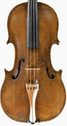 an old violin that is on display