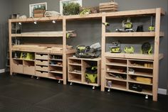 a room filled with lots of wooden shelves and tools on top of each shelf in front of a gray wall