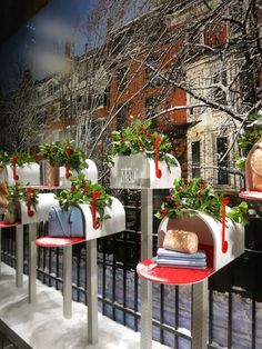 several mail boxes with christmas decorations on them