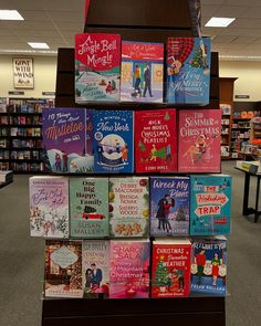 a stack of children's books on display in a bookstore or book sale area