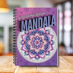 an adult coloring book on a wooden table with the title'coloring book mandal '