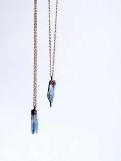 "Kyanite crystal necklace | Raw kyanite jewelry | Kyanite crystal pendant | Blue kyanite pendant | Rough kyanite jewelry | Kyanite necklace This listing is for one small kyanite crystal electroformed and strung on an 18\" copper chain. Our jewelry is unique and one-of-a-kind. Please note there will likely be variances in the size, shape and color of each stone. All elements of your piece are handcrafted in our tiny studio on the island of Martha's Vineyard. Your jewelry will arrive ready for gif Kyanite Necklace, Rough Quartz, Kyanite Jewelry, Kyanite Crystal, Raw Gemstone Jewelry, Raw Crystal Necklace, Quartz Crystal Pendant, Blue Kyanite, Rocks And Gems