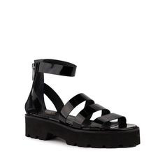 These edgy flatform sandals feature a lug sole and strappy caged silhouette in high-shine patent leather. With a comfy lightweight EVA platform outsole and easy access back zipper, they’re the perfect choice for every occasion under the sun (and moon!). Available in Vacchetta, Cucumber, and Black Patent Leather. Heel H Summer Chunky Platform Sandals In Patent Leather, Edgy Chunky Platform Summer Sandals, Edgy Chunky Platform Sandals For Summer, Edgy Spring Platform Sandals, Edgy Spring Sandals With Chunky Platform, Edgy Chunky Platform Sandals For Spring, Trendy Sandals With Lug Sole, Modern Jelly Sandals With Translucent Outsole For Spring, Trendy Patent Leather Sandals For Spring