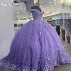 Princess Quinceanera Ball Gown With Ruffles, Purple Floor-length Quinceanera Dress, Fitted Purple Dress For Quinceanera, Purple Princess Dress For Prom Season, Princess Quinceanera Dress With Ruffles, Princess Style Quinceanera Dress With Ruffles, Lavender Ball Gown For Quinceanera, Sweet 16 Fitted Gown With Ruffles, Fitted Ruffle Gown For Sweet 16