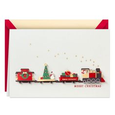 a christmas card with a train and santa's sleigh on the tracks