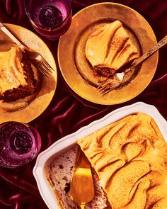 two plates with desserts on them, one has a slice missing from the cake