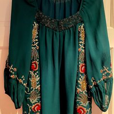 Beautiful, Flowy Blouse. Embroidery Is Absolutely Gorgeous. Full Top With Flowy Sleeves. Embroidery All Around. New Without Tags. Too Big On Me :-( Runs Big. Says Size 2. Should Fit 4 Or 6. Would Look Great Dressed Up Or Dressed Down With Jeans. Green Embroidered Long Sleeve Festive Dress, Embroidered Green Blouse For Fall, Green Long Sleeve Embroidered Festive Dress, Festive Resham Embroidery Tunic Top, Festive Long Sleeve Green Embroidered Dress, Green Intricately Embroidered Festive Top, Green Embroidered Top For Festive Occasions, Festive Green Embroidered Floral Top, Festive Green Floral Embroidered Top