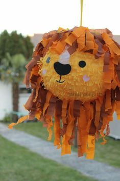 a lion pinata hanging from a string