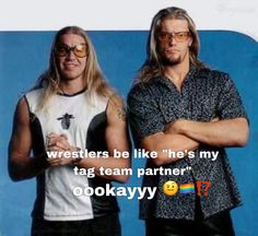 two men standing next to each other in front of a blue background with the caption, wrestleres be like he's my tag team partner