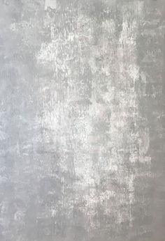 an old grungy textured wall in grey and white colors with no paint on it