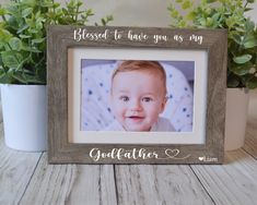 a photo frame with a baby's face on it